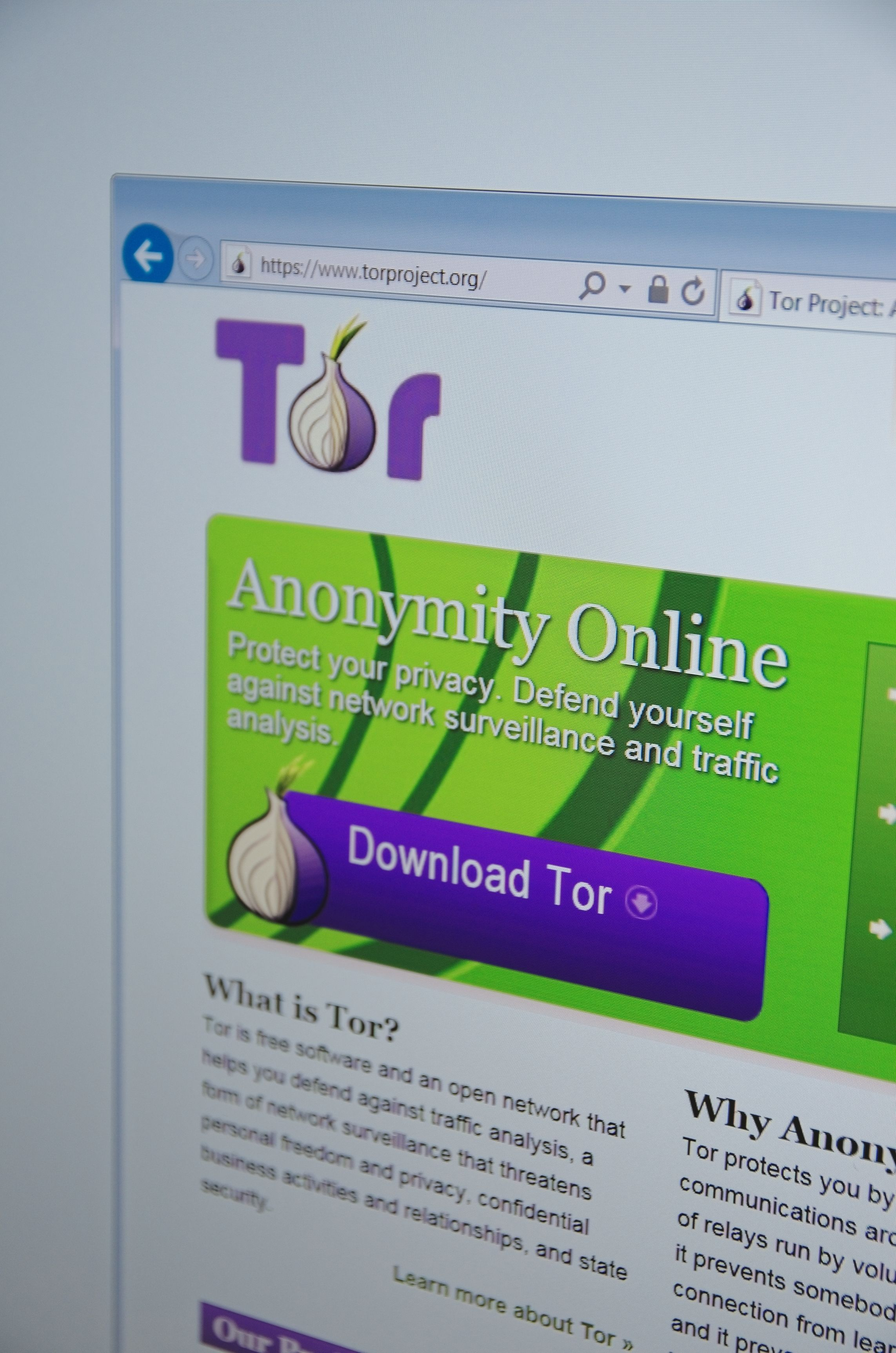 A computer screen shows details of Tor project main page on its website with the phrase "Anonymity Online" prominently featured.