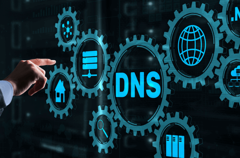 Hologram of several interlocking gears with a hand reaching out to touch them. The largest gear says, "DNS."