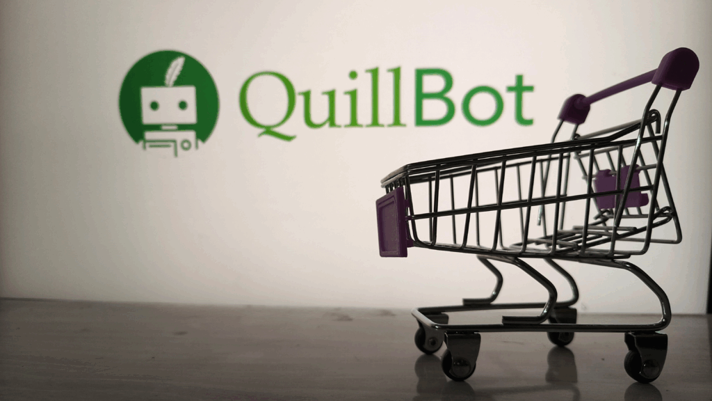 A shopping cart in front of a wall with the extended QuillBot logo on it.