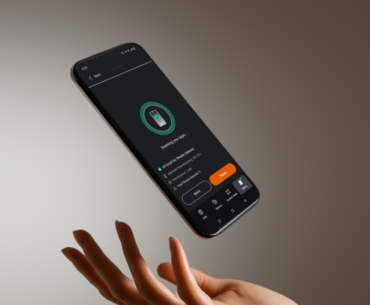 A closeup of a hand tossing an Android phone with the PrivadoVPN app on the screen.